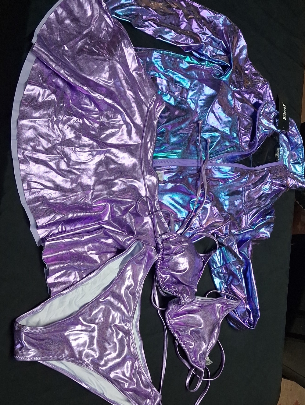 Brand new four-piece swimsuit set. Jacket small, skirt and bikini is a medium.